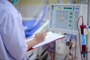 Dialysis nurse are checking dialysis machine before hemodialysis replacement kidney dysfunction or renal failure in intensive care unit.